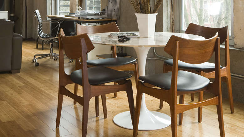 Tulip table and wooden chairs