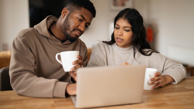 Couple looking at laptop