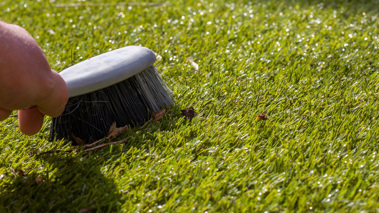 Brushing grass