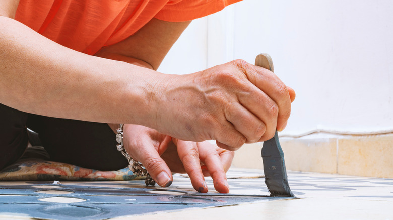 Woman stenciling