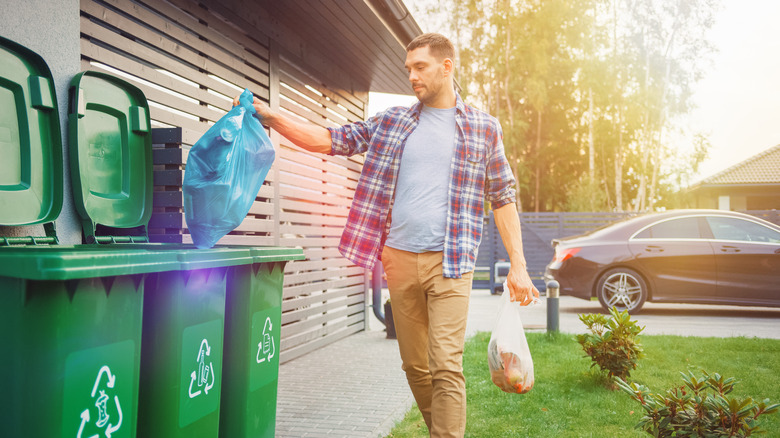 Man throwing away garbage