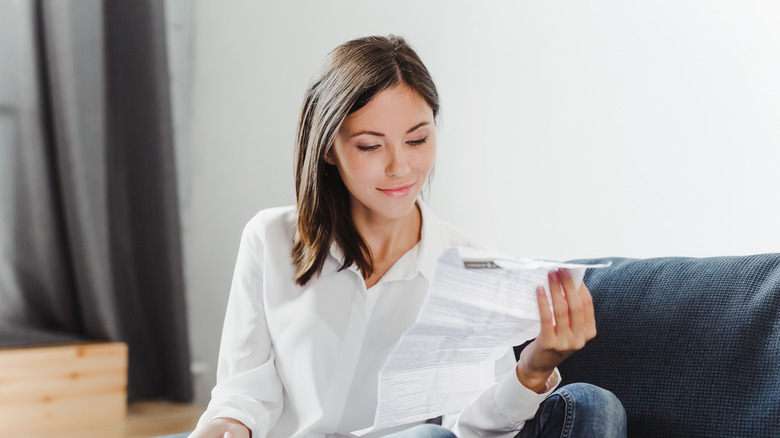 Woman reading instruction manual