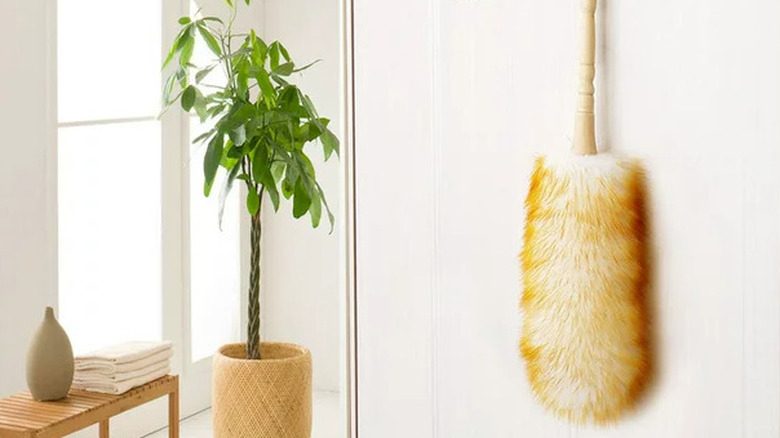 wool duster hanging on wall