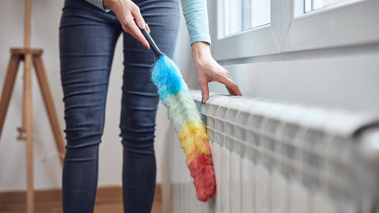 cleaning radiator with duster