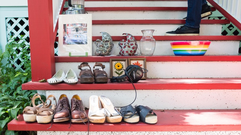 cluttered stairs with shoes