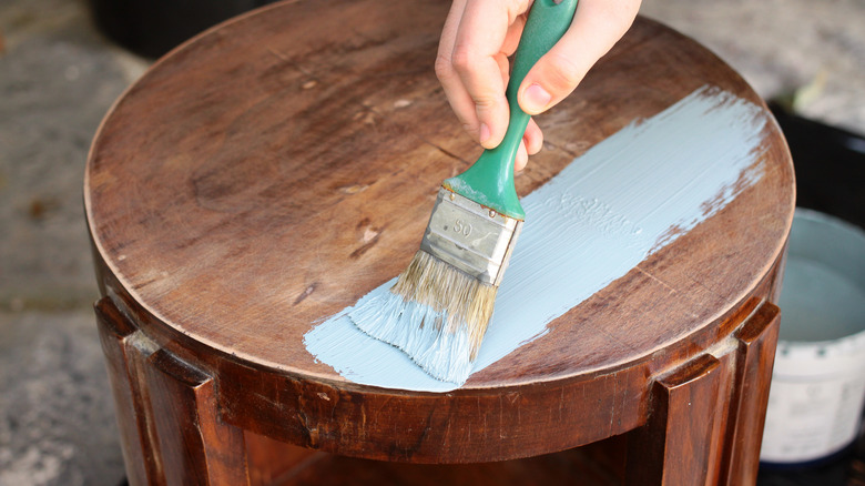 Person painting table