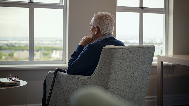 older man in gray seat