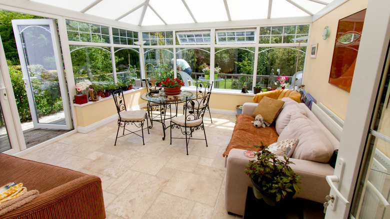 sunroom with couch and table