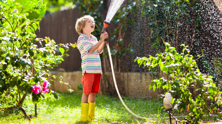 child with a hose