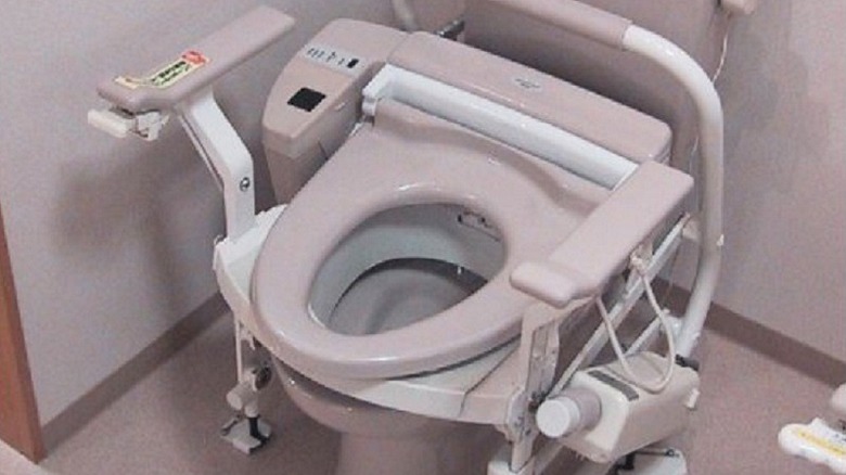 Toilet with lift seat