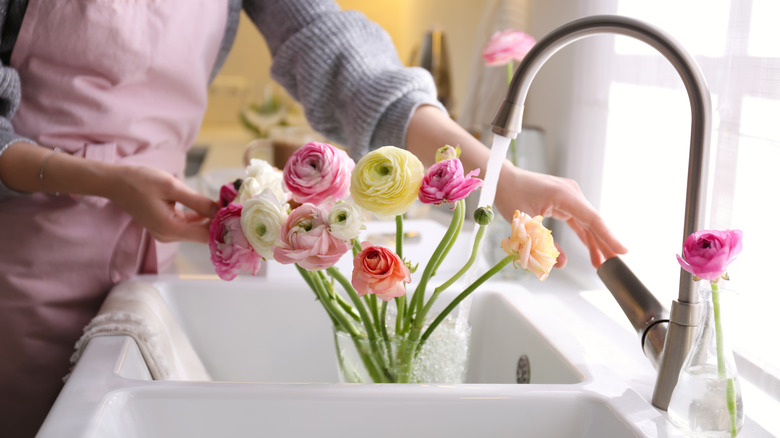 cut flowers in vase sink