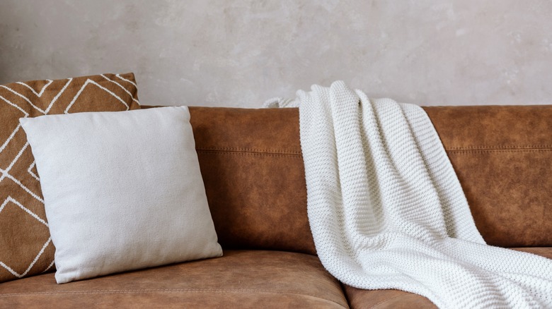 leather couch with pillows