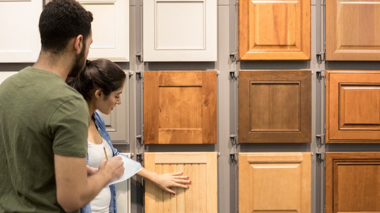 couple looking at cabinet samples