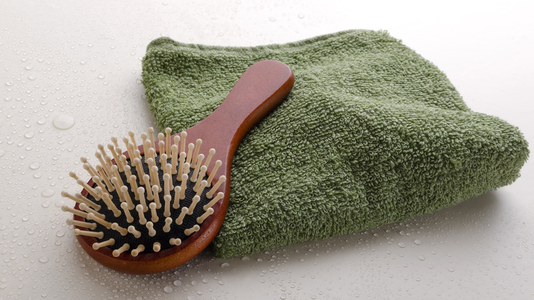 small brush on green towel