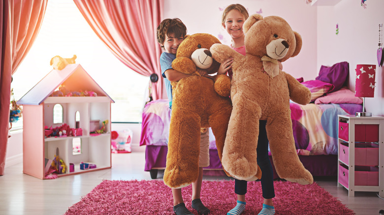 kids with large toy bears