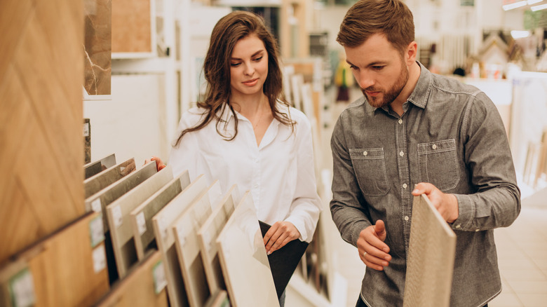 Man and woman browsing tiles