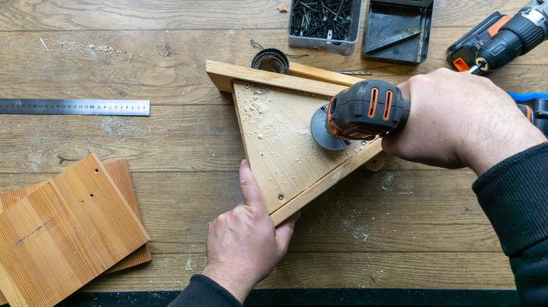 drilling holes in birdhouse