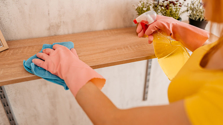 Wiping down shelf