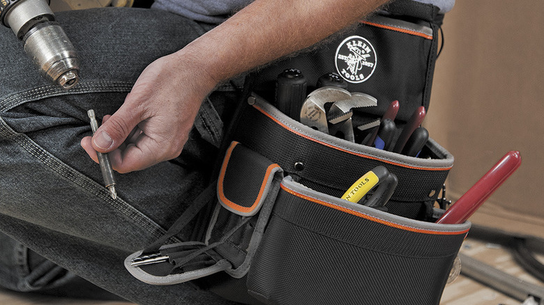 Worker using Klein Tools tool belt