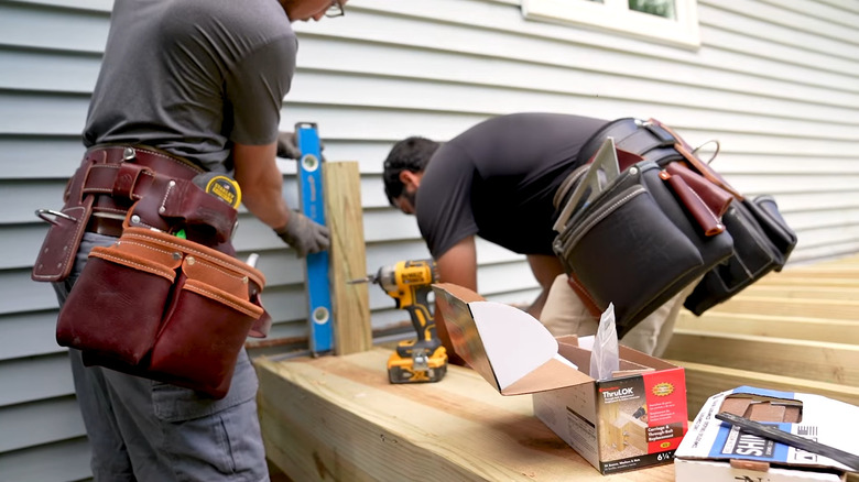 Workers wearing Occidental Leather tool belts