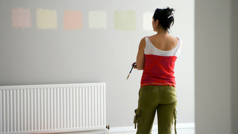 Woman selecting paint swatch