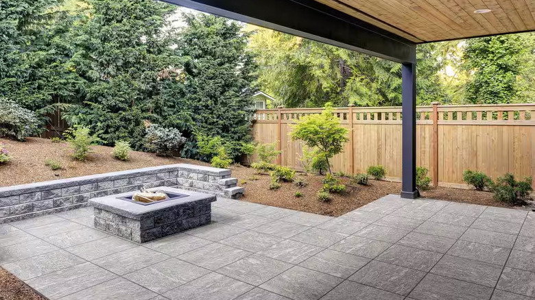 Grey tiled loggia with fire pit