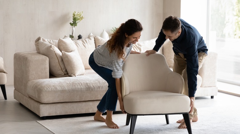 couple moving in a chair