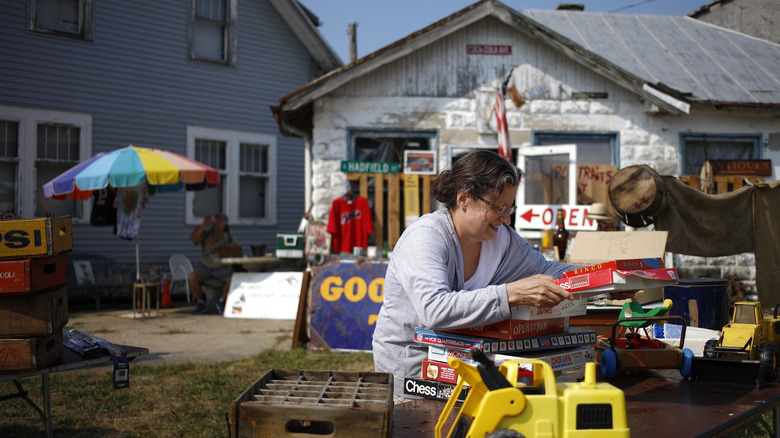 woman enjoying yard sale