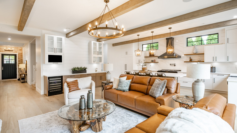 A living room with architectural beams