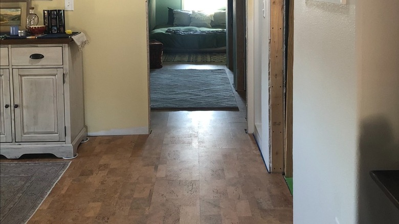 An attic bedroom has cork flooring.