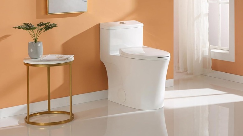 Small table next to one-piece toilet