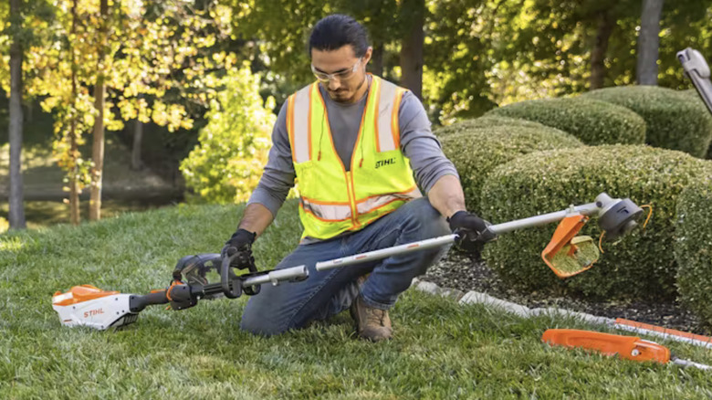 Photo of a man using STIHL KombiSystem with an attachment