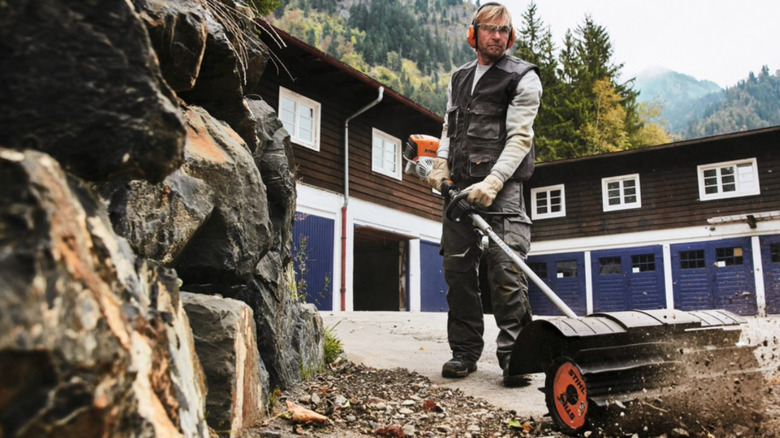 Person using the STIHL powersweep attachment