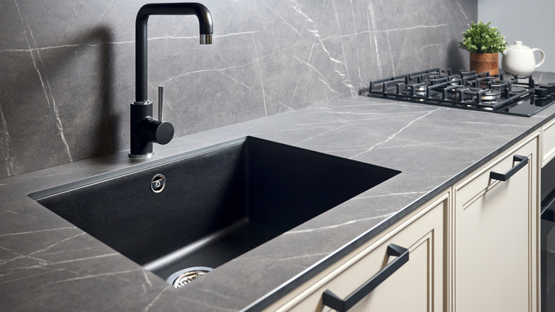 black kitchen sink with gray matte countertop