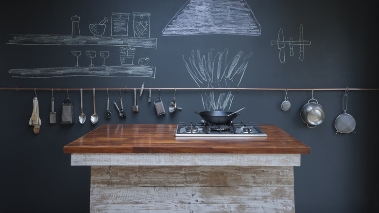 copper railing in black kitchen