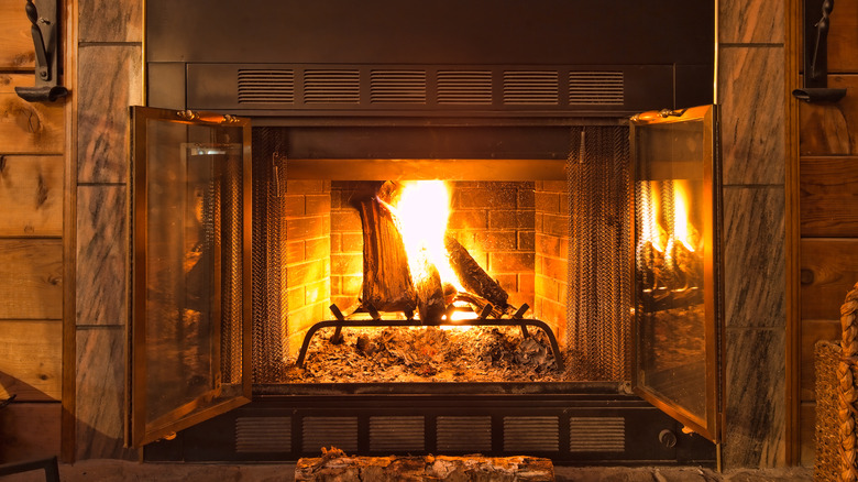 stone fireplace with flames