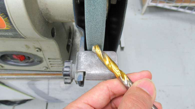 Sharpening drill bit on grinder