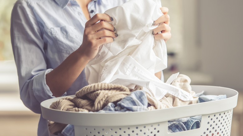 Person with a basket of clean, bright laundry