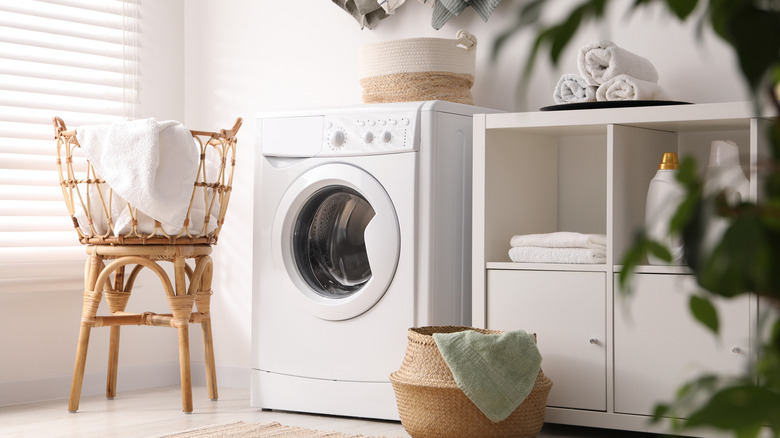 Laundry room with baskets and shelves.