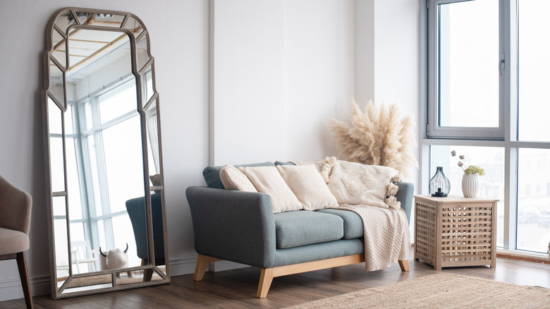 living room with wall mirror