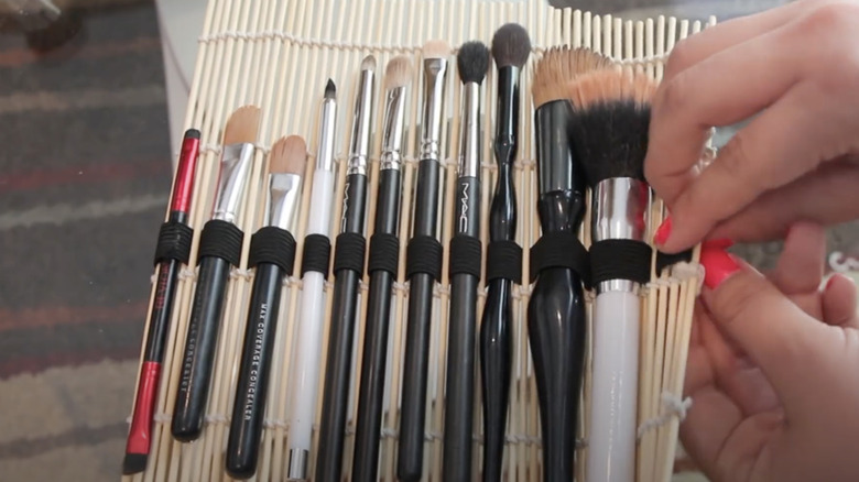 YouTube DIY turning a sushi mat into a makeup brush holder.