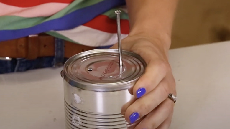 Drainage holes in tin can