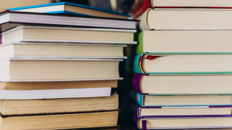 stacks of used hardcover books