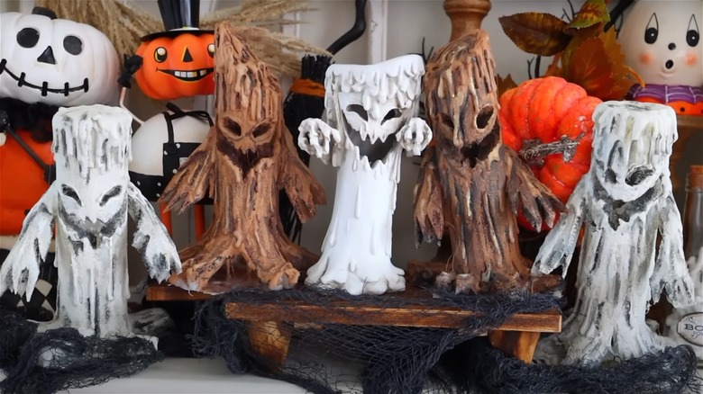 white and brown ghost candles