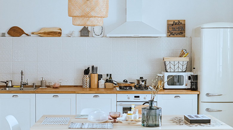 Cutting boards on backsplash ledge