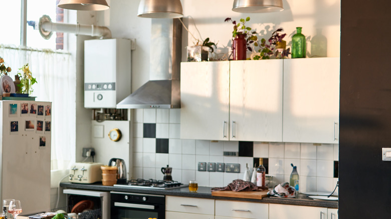 Multicolor vases atop cupboards 