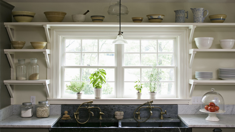 Kitchen pottery atop open shelves