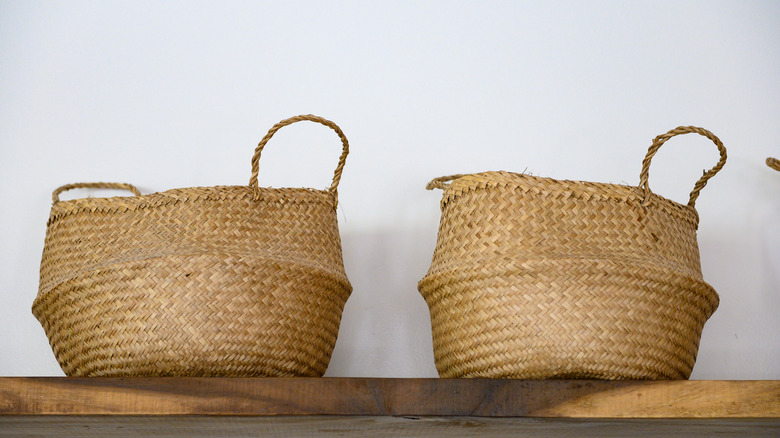 Storage baskets atop shelves