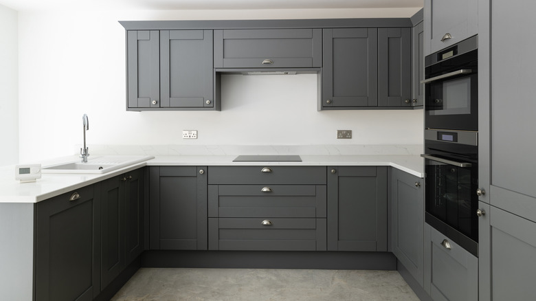 gray cabinets against white walls