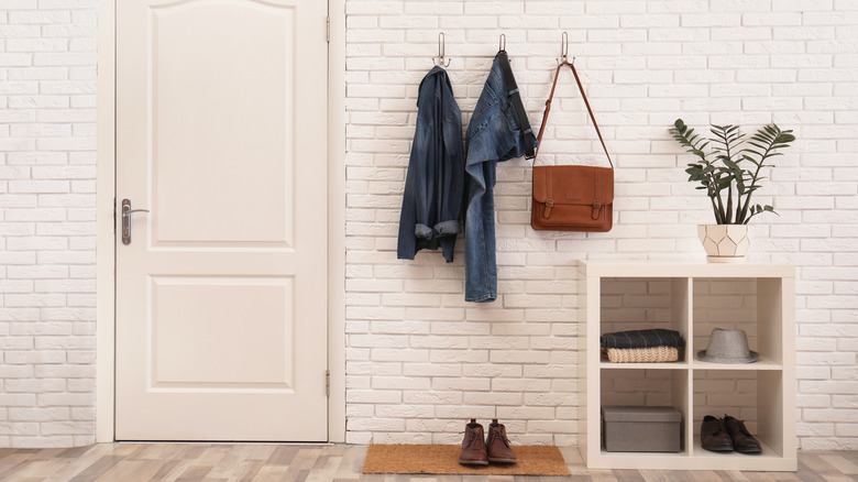 foyer with exposed brick walls